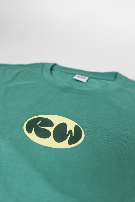 Green t-shirt with a yellow logo on a light gray background