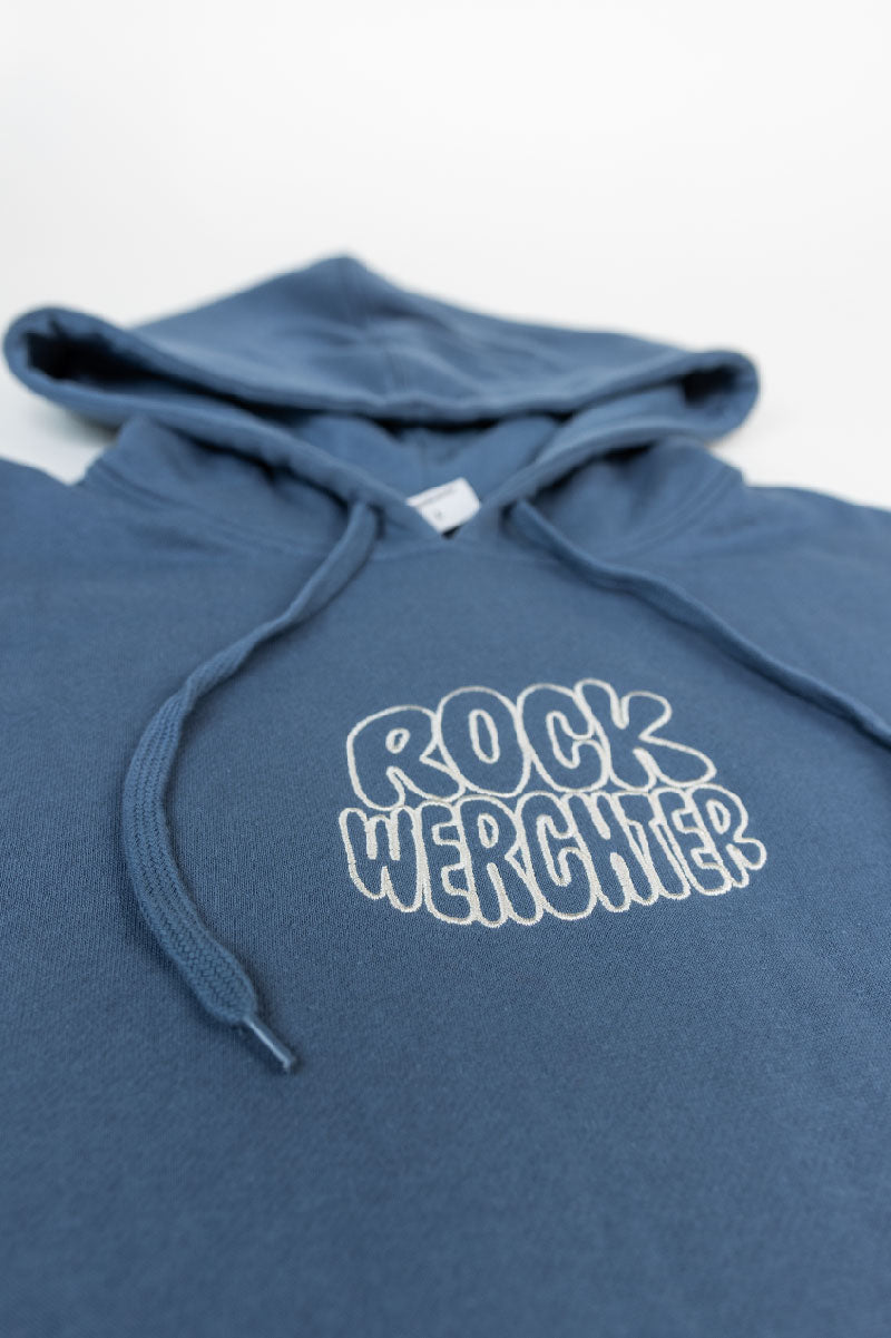 Blue hoodie with 'Rock Werchter' text on a white background