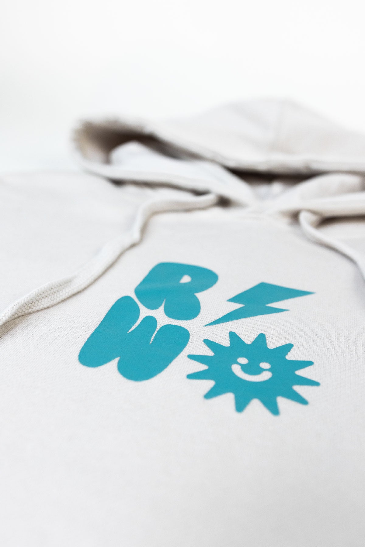 White hoodie with blue graphic design on a white background