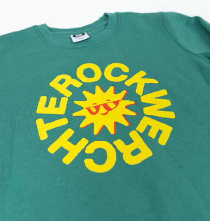 Green t-shirt with yellow graphic design on a white background
