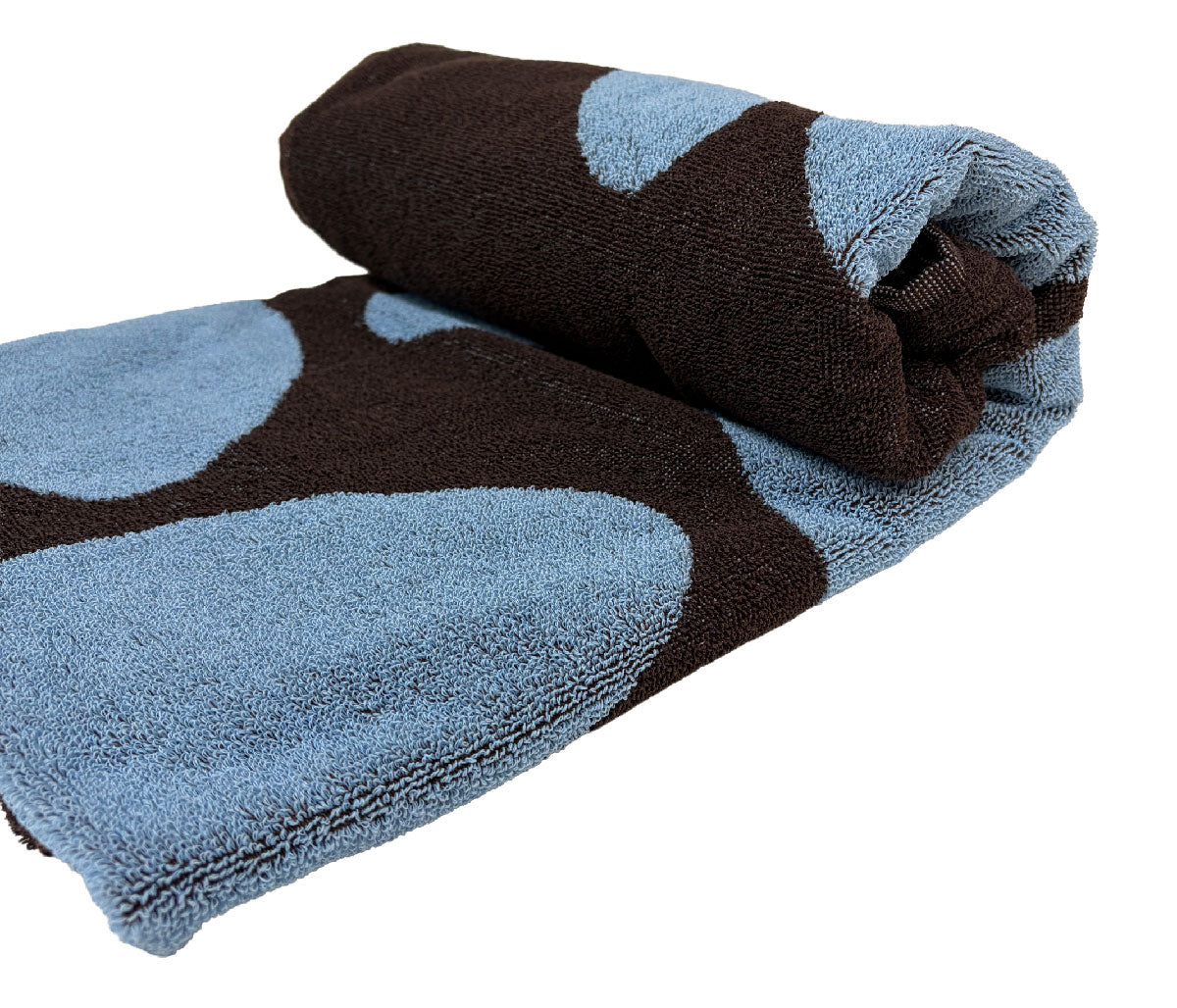 Folded towel with blue and brown pattern on a white background