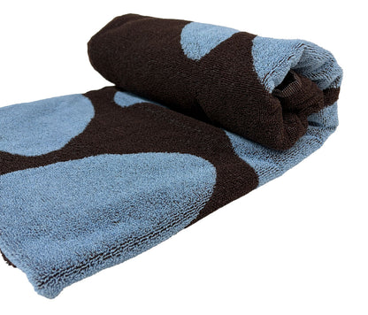 Folded towel with blue and brown pattern on a white background